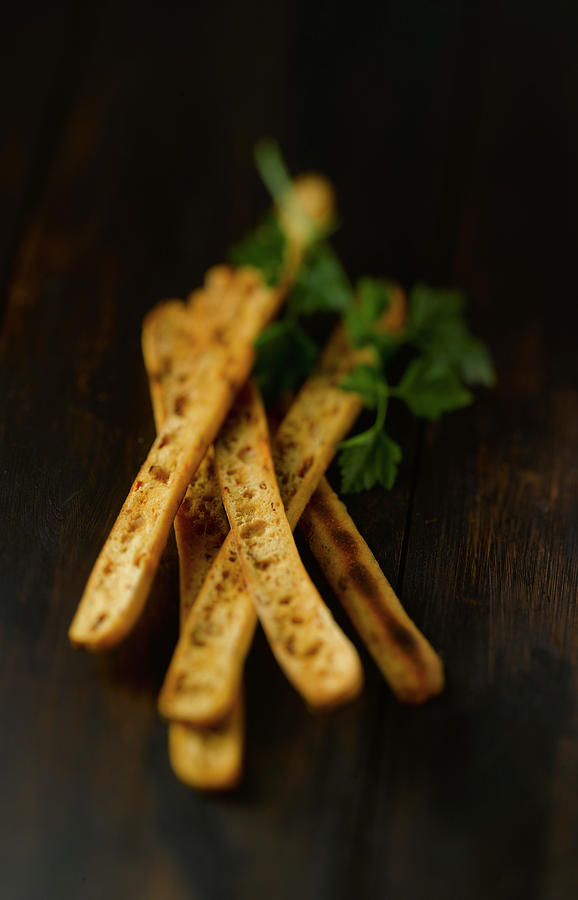 Breadsticks On Wooden Table, Close Up Photograph by Westend61
