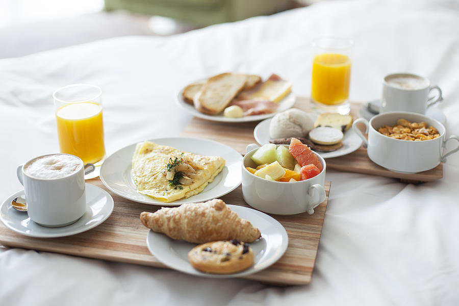 Breakfast in bed Photograph by PhotoAlto/Gabriel Sanchez