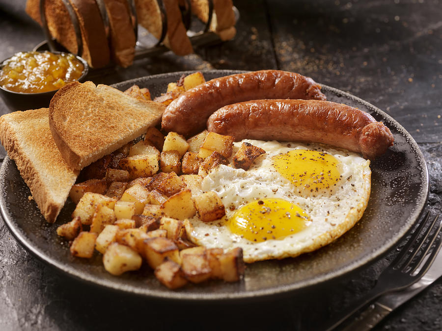 Breakfast with Sunny side up eggs and Sausage Photograph by LauriPatterson