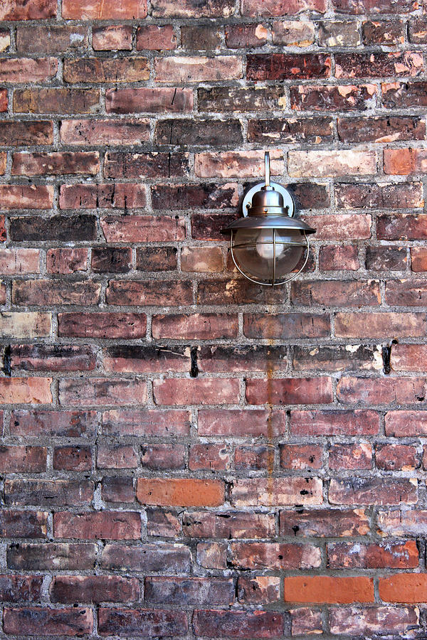 Brick Wall and Metal Lamp Photograph by Mary Bedy