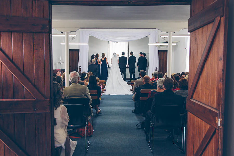 Bridal Party standing on stage in small hall Photograph by Jodie Griggs