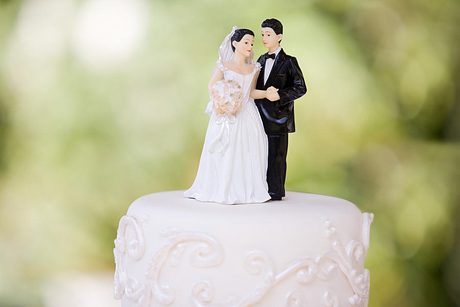 Bride and groom figurines Photograph by Image Source