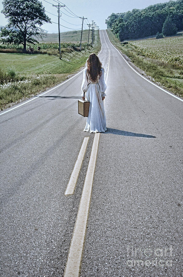 Bride Walking with Suitcase on Country Road Photograph by Jill Battaglia