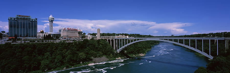 Architecture Photograph - Bridge Across A River, Rainbow Bridge by Panoramic Images