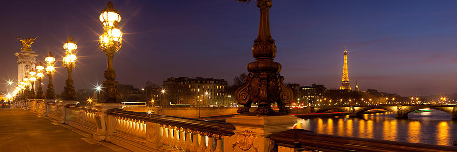 Bridge Across The River Lit Up At Dusk Photograph by Panoramic Images