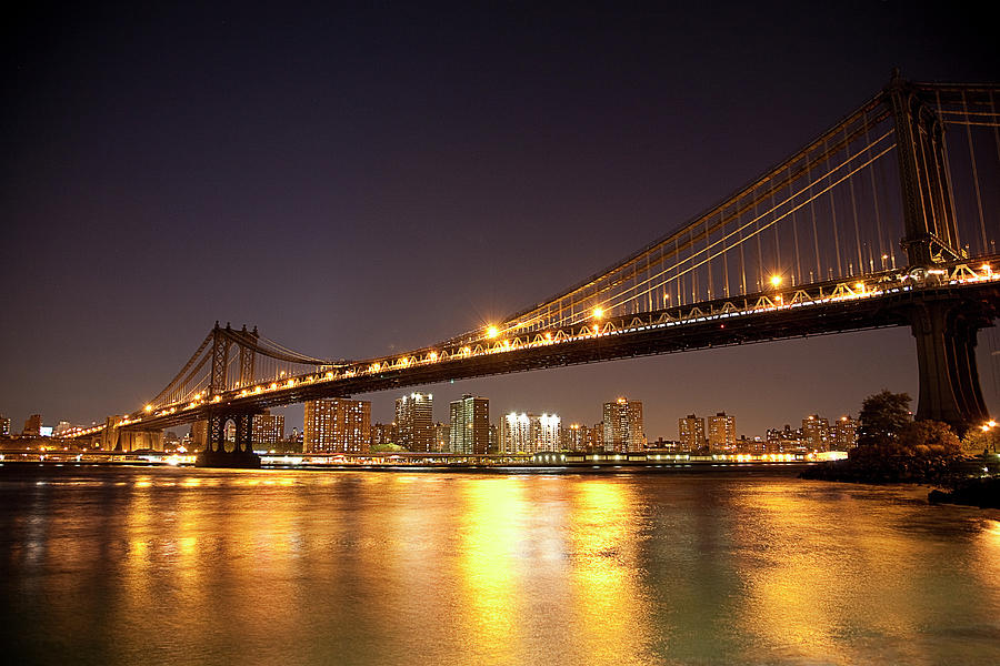 Bridge And City Skyline Lit Up At Night Photograph by Cultura Rf/seb Oliver