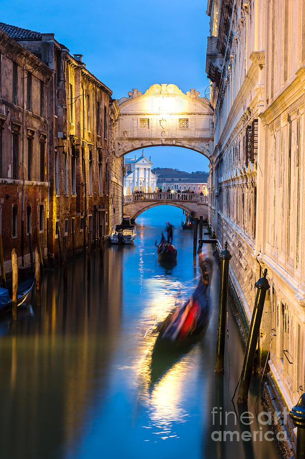 Bridge of Sighs at dusk with gondolas on the canal - Venice Photograph by Matteo Colombo