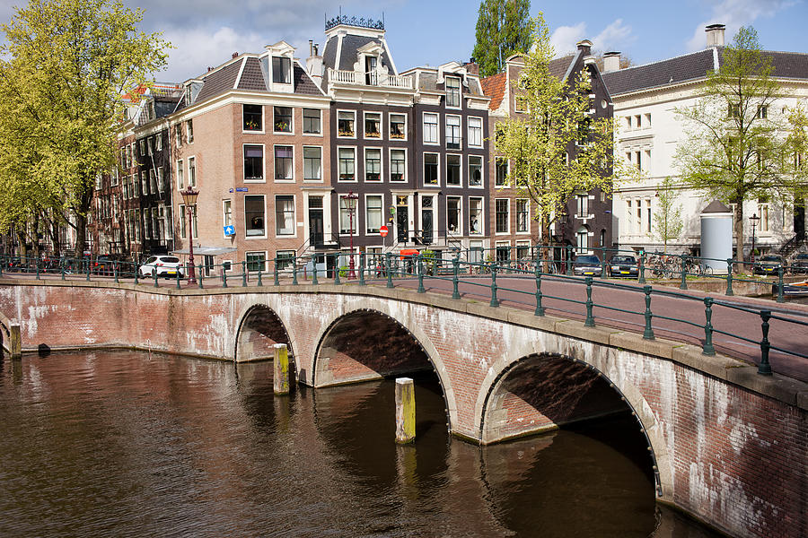 Bridge over Canal and Houses in Amsterdam Photograph by Artur Bogacki