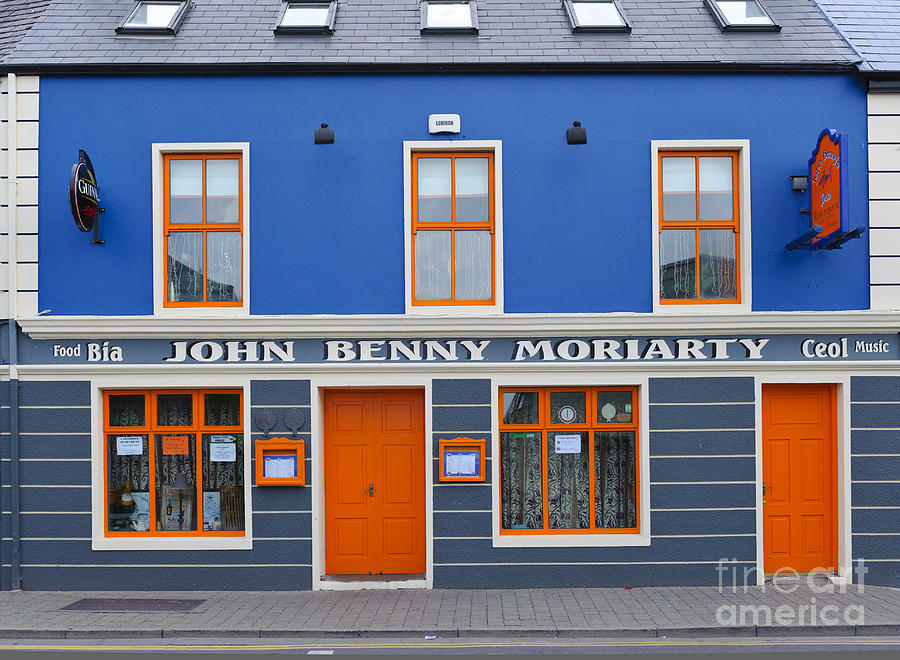 Brightly Colored Pub In Dingle, Ireland Photograph by John Shaw