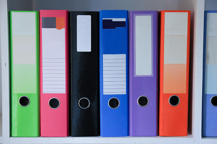 Brightly coloured folders Photograph by Emma Farrer