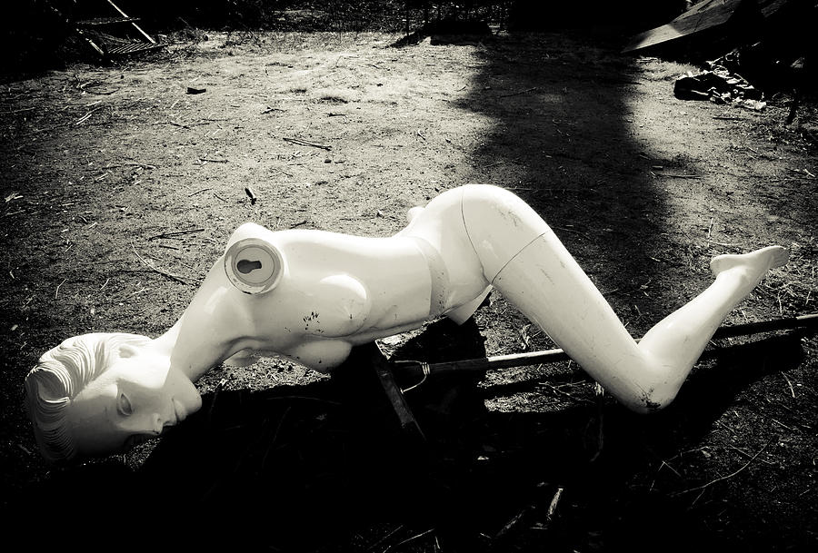 Broken abandoned doll lying on the ground Photograph by Matthias Hauser