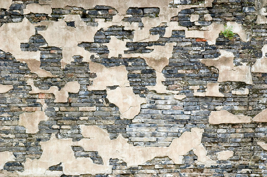 Broken stucco and stone wall. Wuzhen. China. Photograph by Rob Huntley
