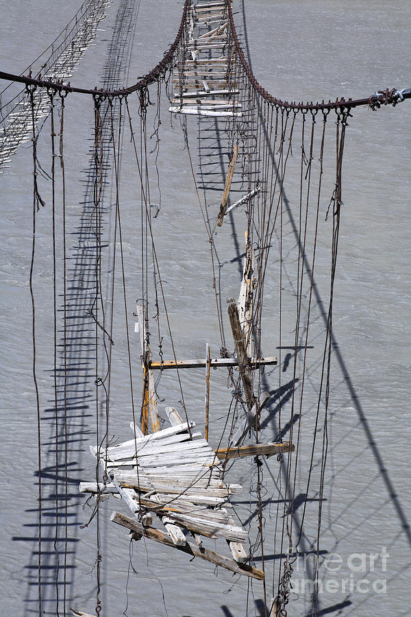 Broken suspension bridge across the Hunza River in Pakistan Photograph by  Robert Preston - Pixels