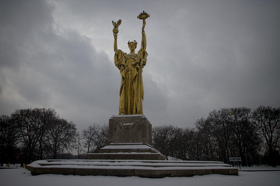 Bronze sculpture against a gray winter backdrop Photograph by Sven Brogren