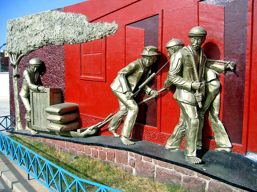 Bronze Workers Pulling A Load Photograph by Jay Milo