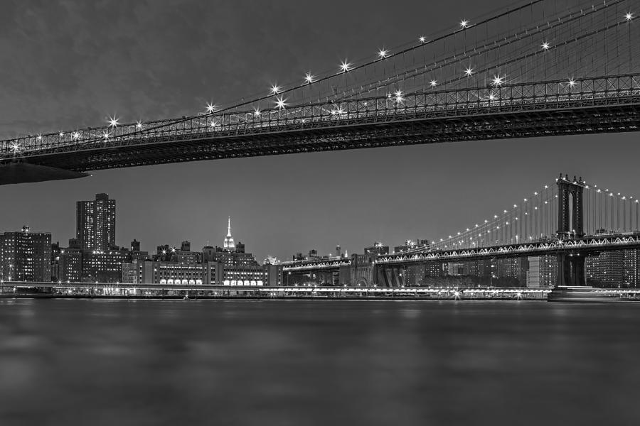 Brooklyn Bridge Frames Manhattan BW Photograph by Susan Candelario
