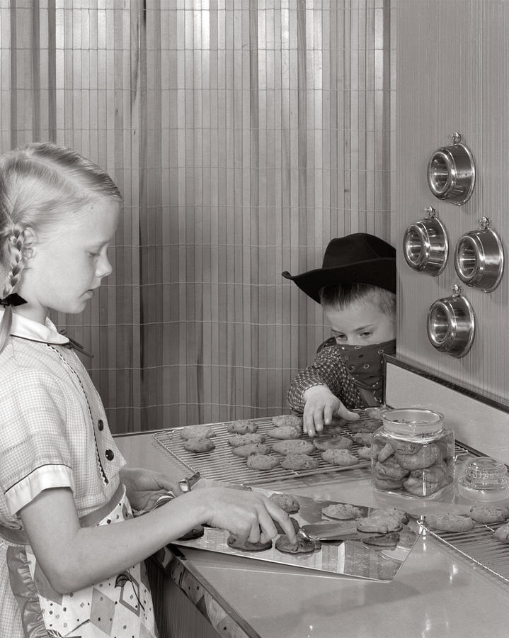 Brother Stealing Sisters Cookies Photograph by L. Fritz/ClassicStock