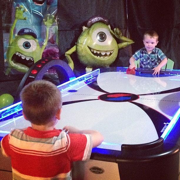 Brotherly Game Of Air Hockey At Photograph by Kelly Bartlett