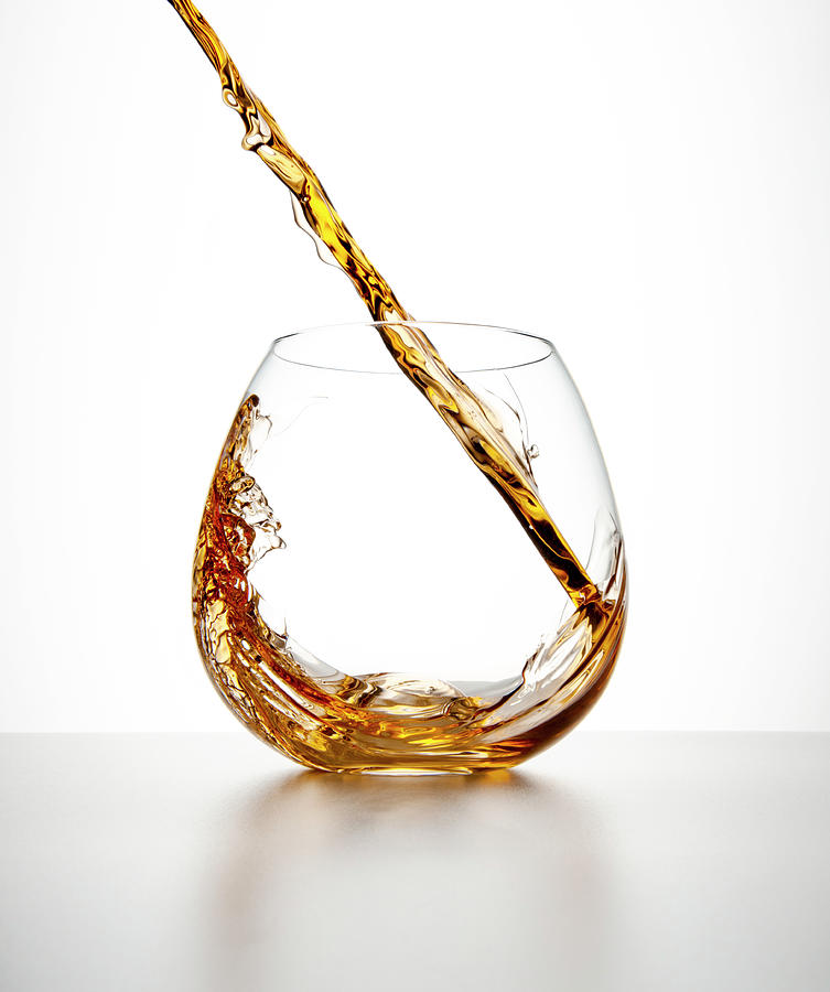 Brown Liquor Streaming Into A Glass Photograph by Chris Stein