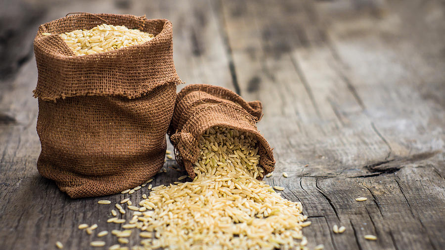 Cereal Photograph - Brown rice bags by Aged Pixel