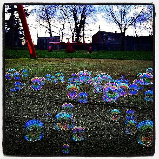 Fantasy Photograph - Bubbles Layer On Artificial Grass by Urbane Alien