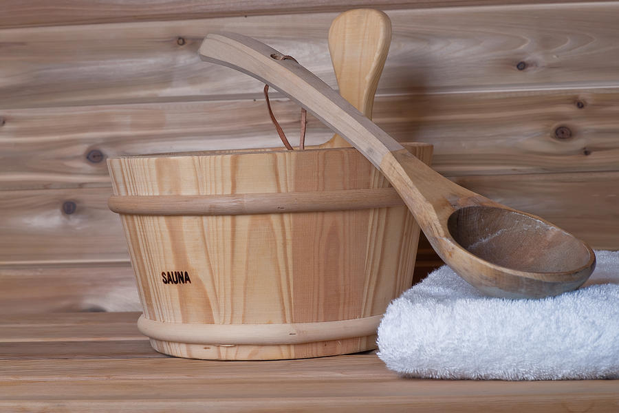 Bucket And Ladle Spoon in Sauna Photograph by Marek Poplawski