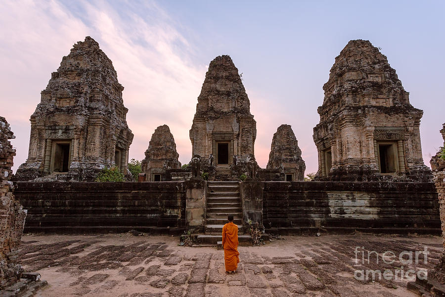 Buddhist monk looking at temple - Angkor wat - Cambodia Photograph by Matteo Colombo