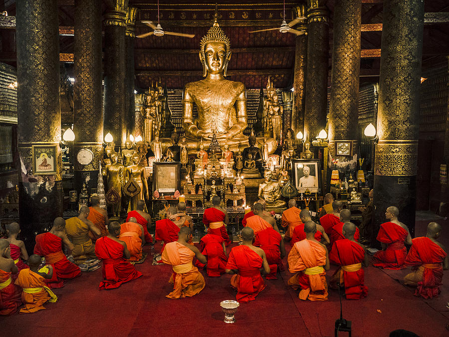Buddhist monks praying in Wat Mail during Vesak Luang Prabang Laos Photograph by Aluxum