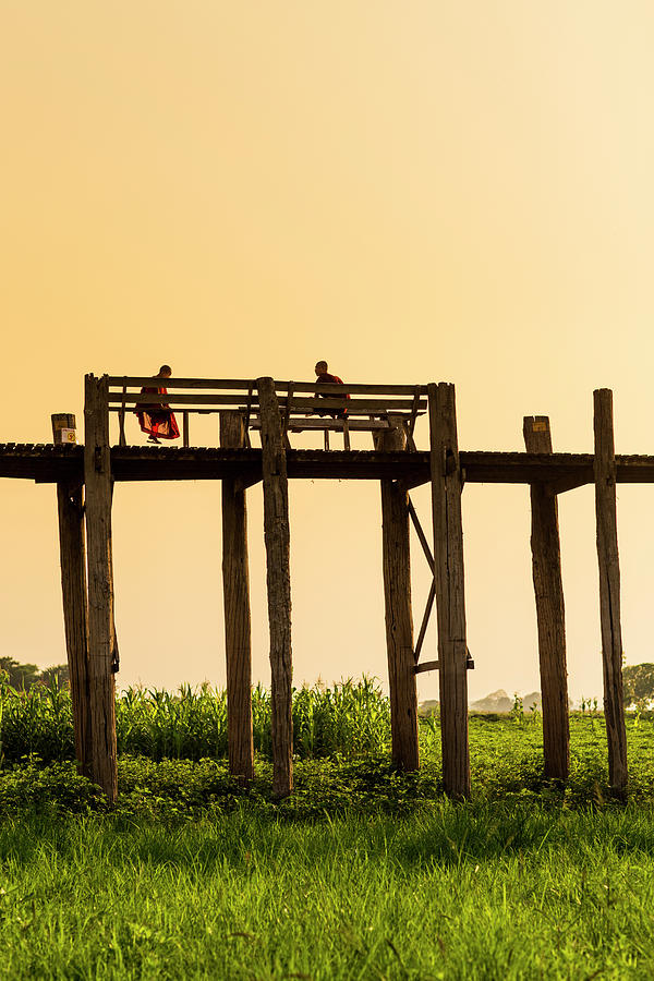 Buddhist Monks Seated On U Bein Bridge Photograph by Merten Snijders Buddhist Monks Seated On U Bein Bridge Photograph by Merten Snijders