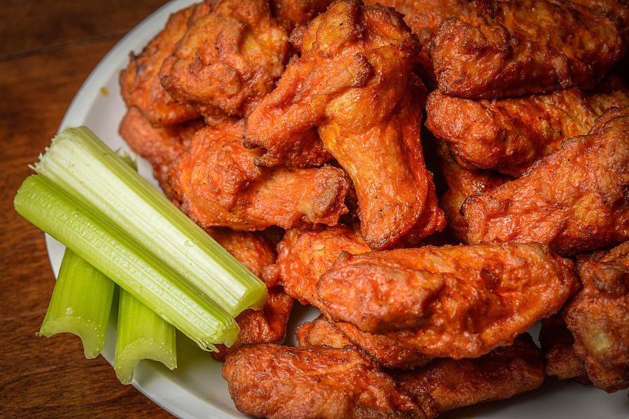 Buffalo Wings with Celery Sticks Photograph by Brandon Bourdages