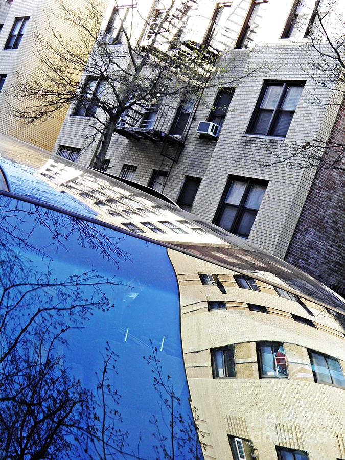 Building Reflected on a Parked Car Photograph by Sarah Loft