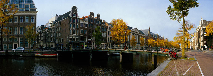 Architecture Photograph - Buildings Along A Canal, Amsterdam by Panoramic Images