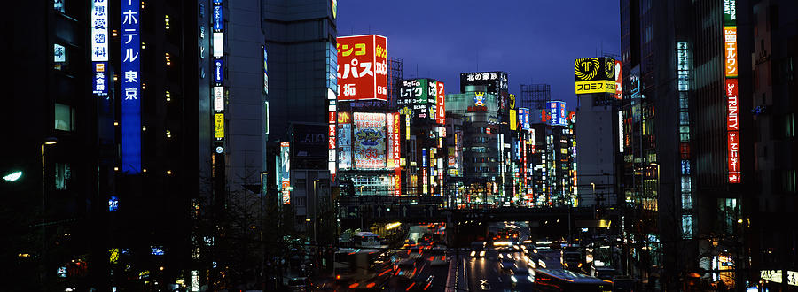 Architecture Photograph - Buildings Lit Up At Night, Shinjuku by Panoramic Images