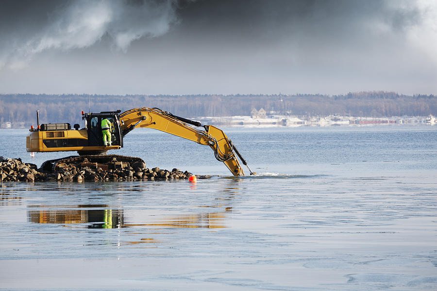 Bulldozer Excavating In The Sea Photograph by Christian Lagereek