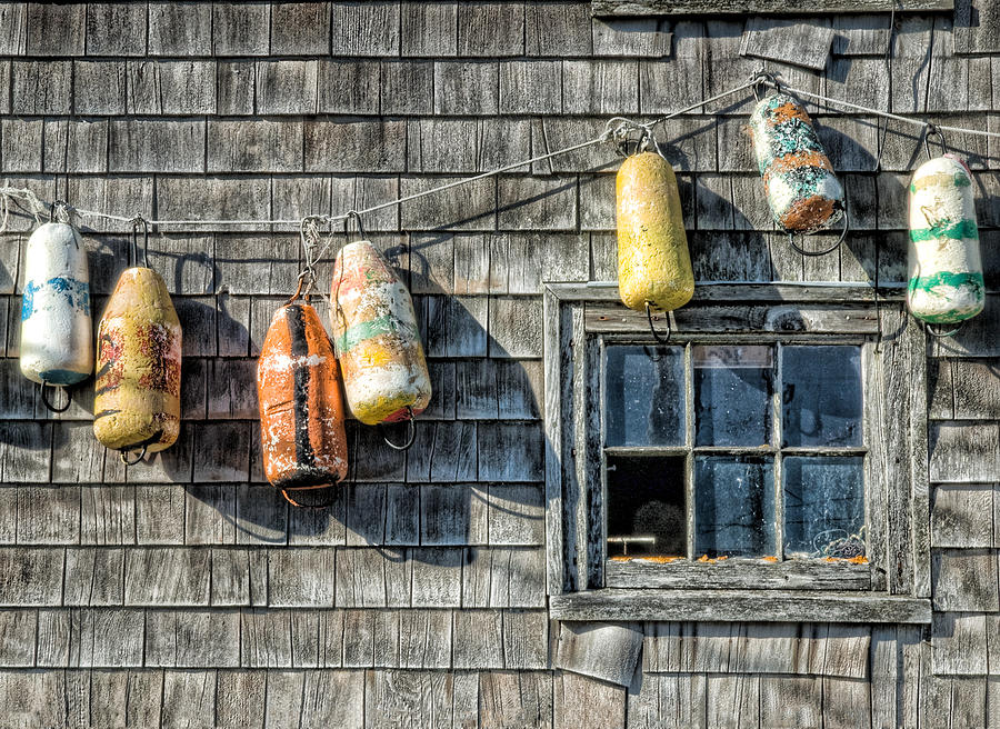 Buoys on a Wall at Peggys Cove Photograph by Rob Huntley