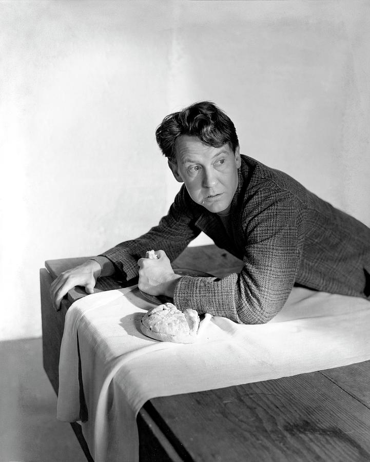 Burgess Meredith Eating A Loaf Of Bread Photograph by Horst P. Horst