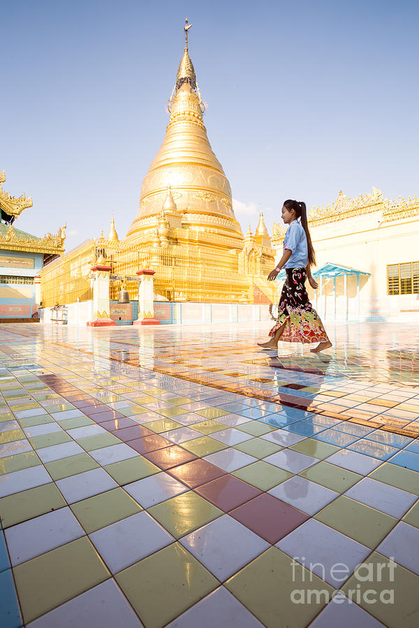 Burmese woman walking near golden pagoda - Myanmar Photograph by Matteo Colombo