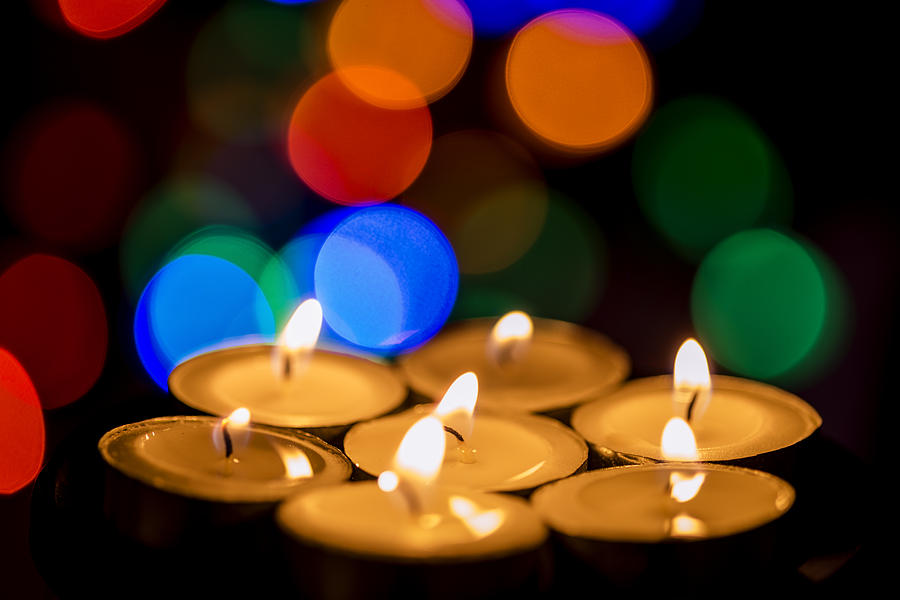 Christmas Photograph - Burning candles with colorful bokeh by Vishwanath Bhat