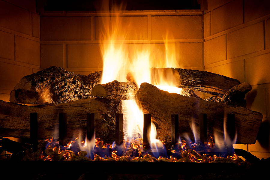 Burning Logs and Glowing Embers In Gas Fireplace Photograph by Ryasick