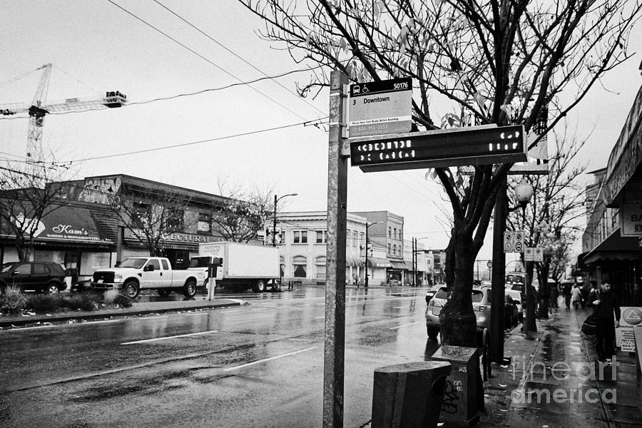 City Photograph - bus stop on main street heading downtown from mount pleasant on a wet day Vancouver BC Canada by Joe Fox