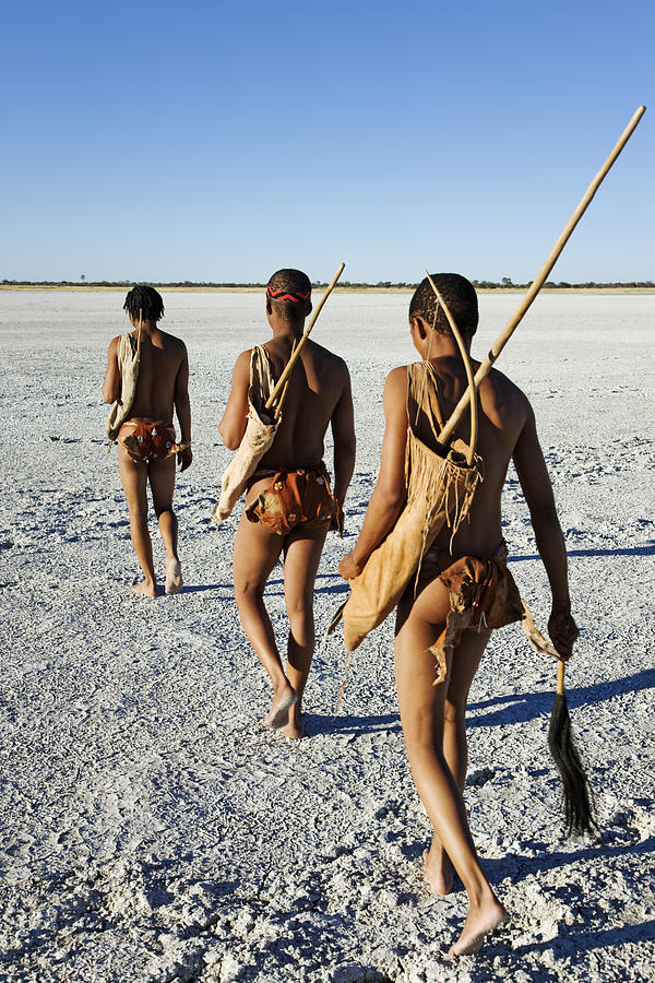 Bushmen dressed in traditional skins. Photograph by Martin Harvey