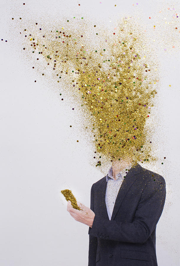 Business man head exploding into gold dust Photograph by Emma Innocenti