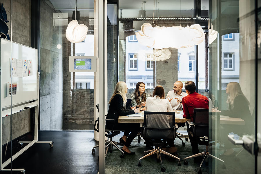Business meeting in a modern office. Photograph by Hinterhaus Productions
