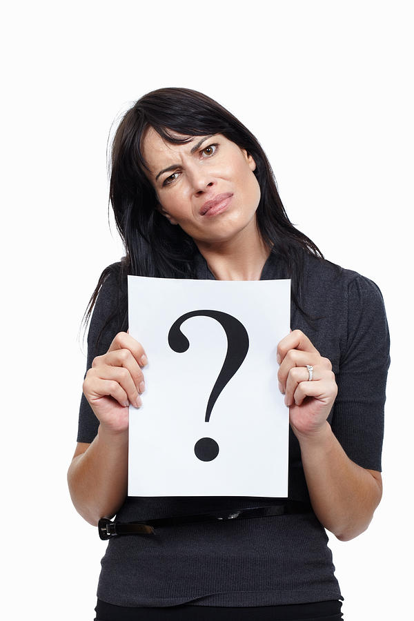 Business woman with a question Photograph by GlobalStock