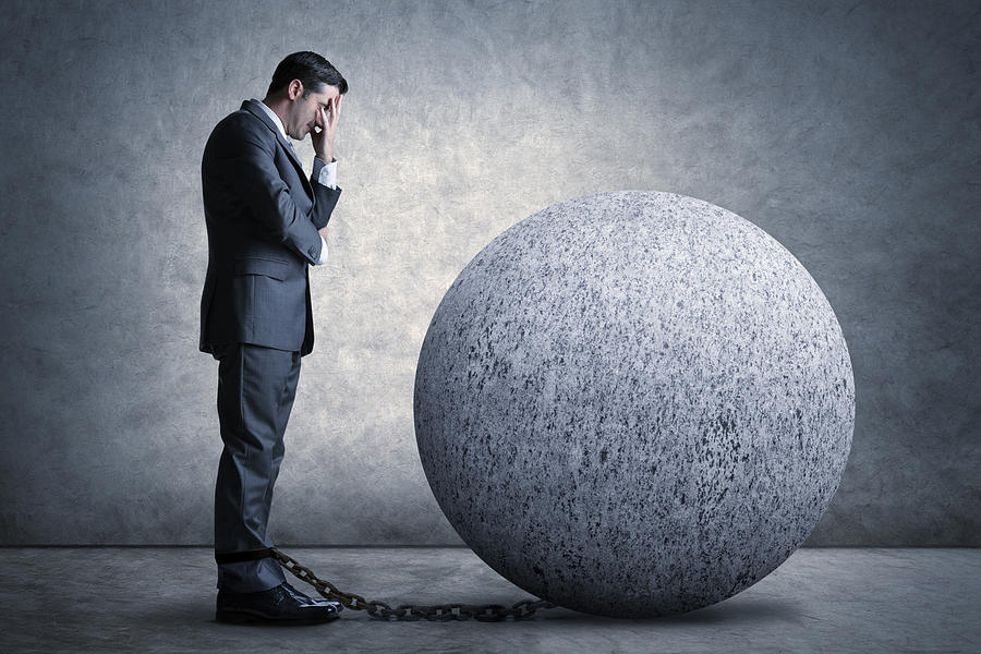Businessman Burdened By A Ball And Chain Photograph by Dny59