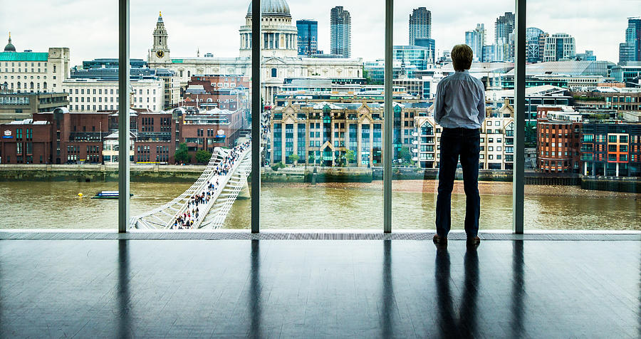 Businessman looks at the London Skyline from his Office Window Photograph by Coldsnowstorm
