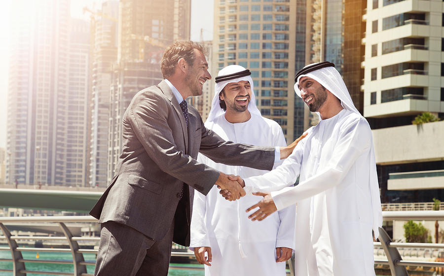 Businessmen struck a deal in Dubai. Photograph by Eli_asenova