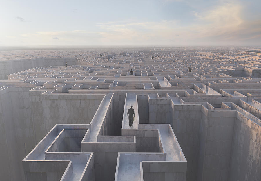 Businessmen walking on top of complex maze Photograph by Colin Anderson Productions pty ltd