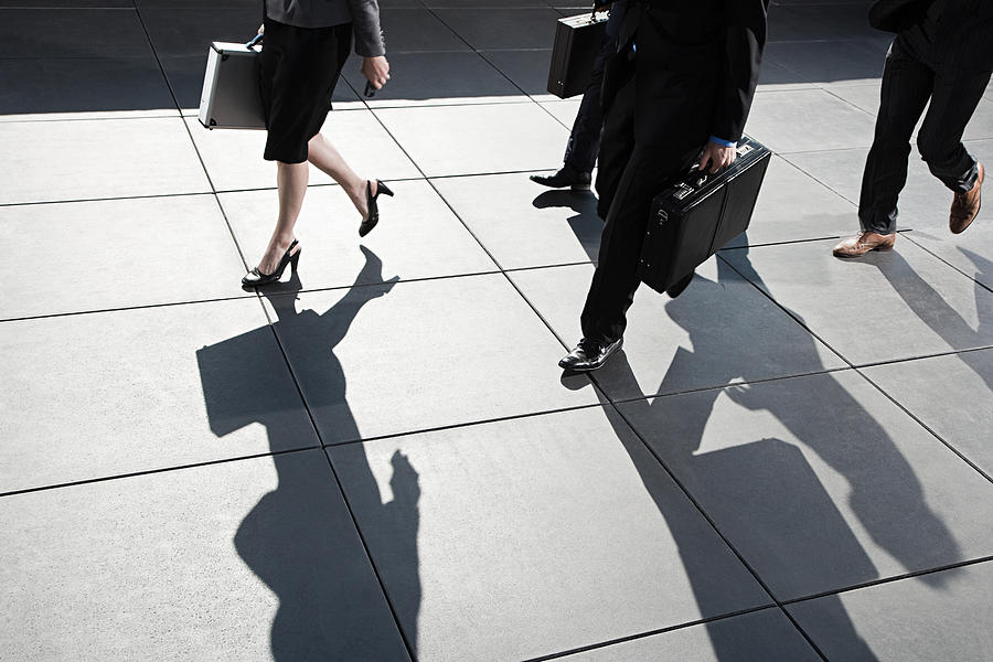 Businesspeople walking Photograph by Image Source