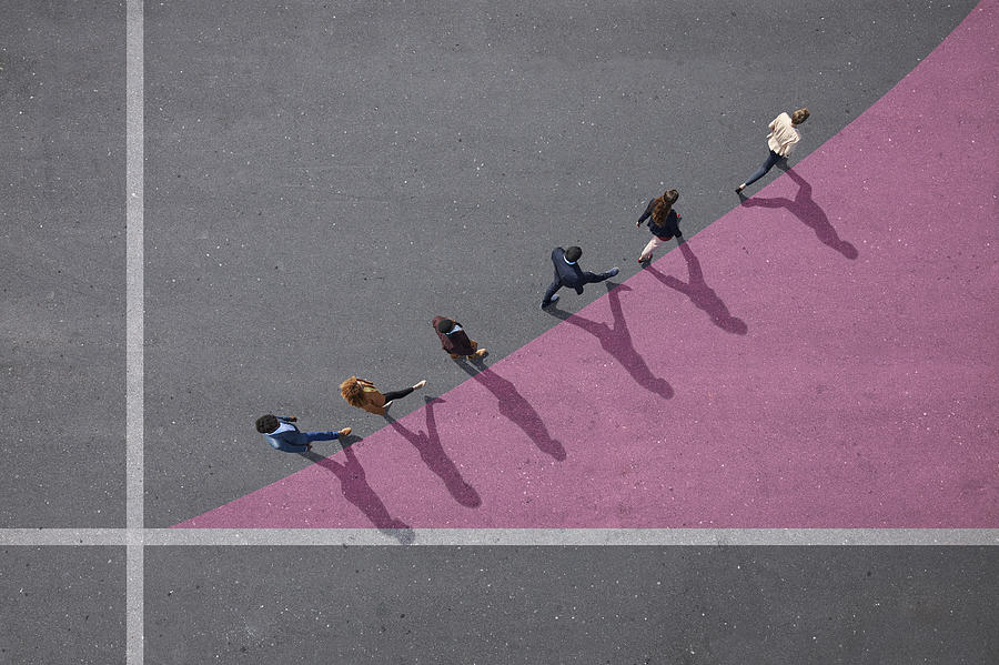 Businesspeople walking on painted up going graph, on asphalt Photograph by Klaus Vedfelt